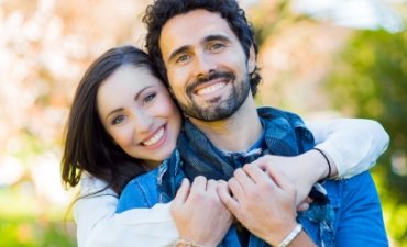 Young couple with bright, healthy smiles - Cosmetic Dentistry at Meadows Dental Group