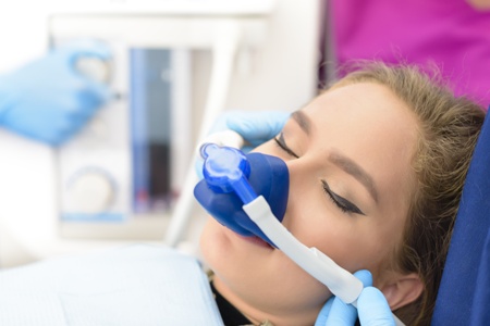 woman getting dental sedation with nitrous oxide